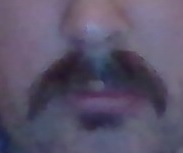 ILB's nose and mouth, with a moustache that makes him look like a '70s porn star, and a superfluous soul patch.